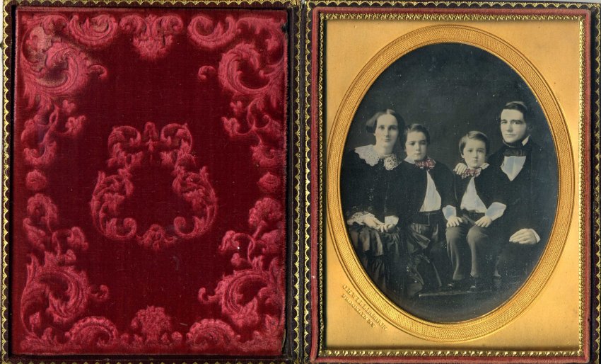 A circa 1853 daguerreotype image shows Maria Farmer, her husband Eli Robbins, and their two sons, both of whom died before reaching adulthood. Note the elaborate cushion of cut red velvet, intended to protect the glass-encased image.